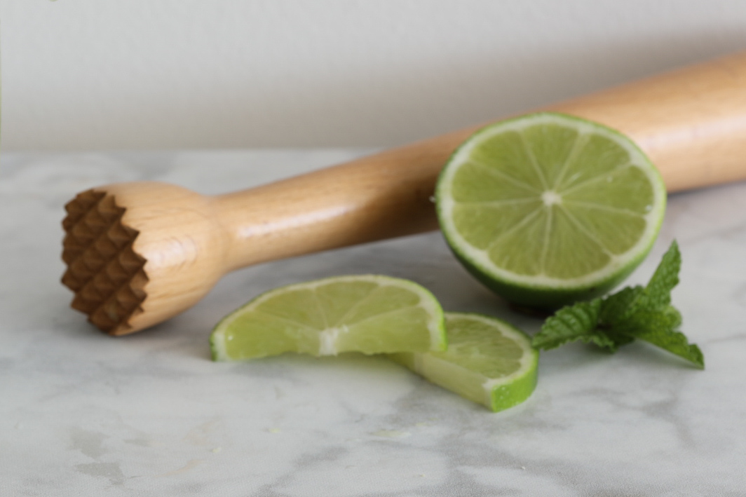 Muddle the lime and mint with a muddler or the end of a wooden spoon for a Low Carb Mojito